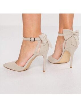 Bow slingback stiletto pumps